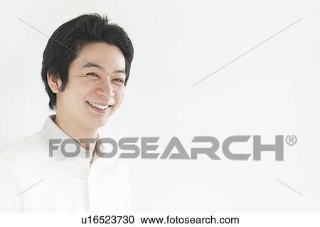 Stock Image - Young man smiling. Fotosearch