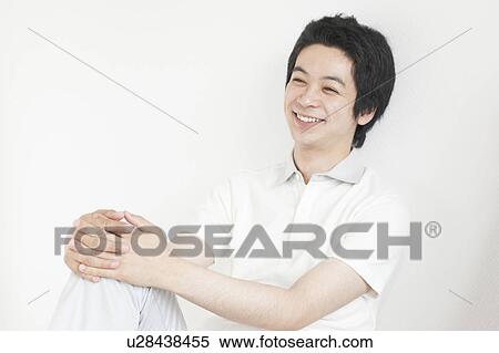 Young man smiling View Large Photo Image Stock Photography - Young man smiling. Fotosearch