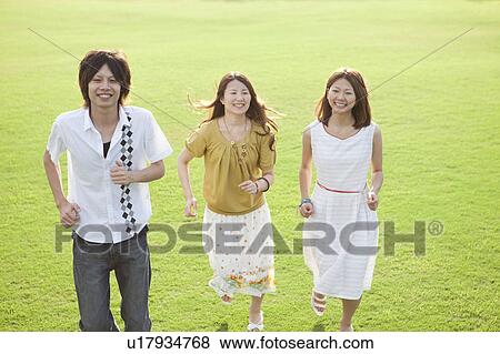 Young people running View Large Photo Image Stock Photo - Young people running. Fotosearch