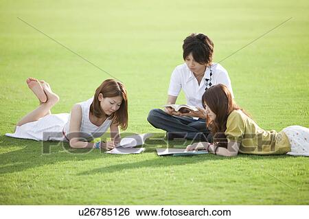 Young people studying outdoors View Large Photo Image Stock Photograph - Young people studying outdoors. Fotosearch