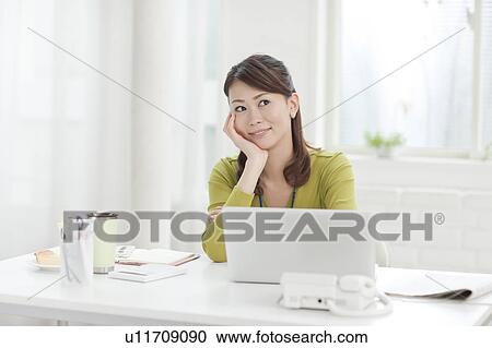 Young Woman at Desk View Large Photo Image Stock Image - Young Woman at Desk. Fotosearch