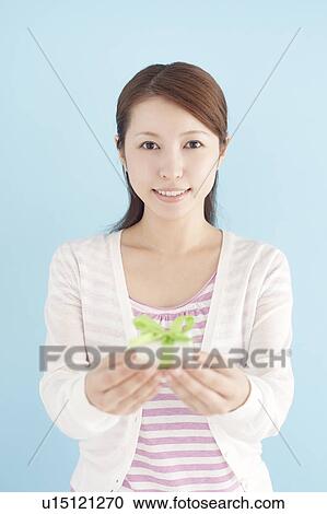 Young Woman Giving Gift View Large Photo Image Stock Image - Young Woman Giving Gift. Fotosearch