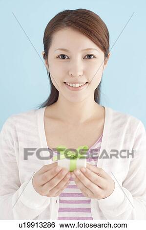 Young Woman Giving Gift View Large Photo Image Stock Photograph - Young Woman Giving Gift. Fotosearch
