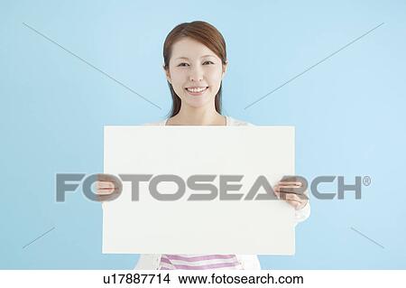 Young Woman Holding Blank Message View Large Photo Image Picture - Young Woman Holding Blank Message. Fotosearch