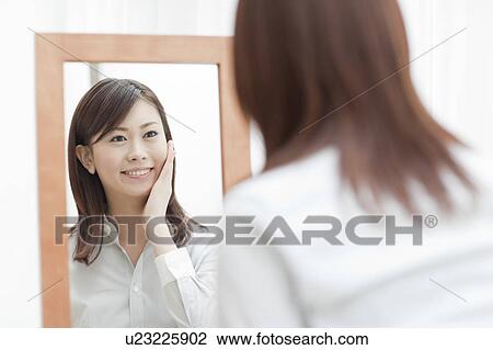 Young Woman In Front Of Mirror View Large Photo Image Stock Image - Young Woman In Front Of Mirror. Fotosearch
