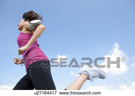 Young Woman jogging View Large Photo Image Stock Photo - Young Woman jogging. Fotosearch