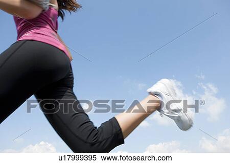 Young Woman jogging View Large Photo Image Stock Photography - Young Woman jogging. Fotosearch