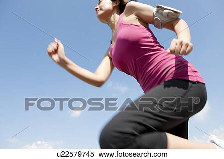Young Woman jogging View Large Photo Image Stock Photography - Young Woman jogging. Fotosearch