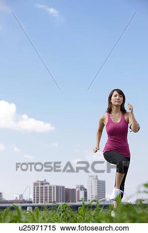 Young Woman jogging View Large Photo Image Stock Photography - Young Woman jogging. Fotosearch