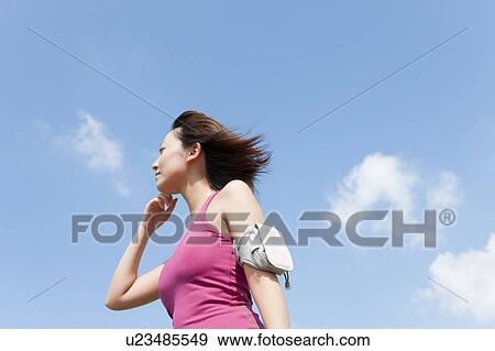 Young woman looking far away View Large Photo Image Stock Photo - Young woman looking far away. Fotosearch