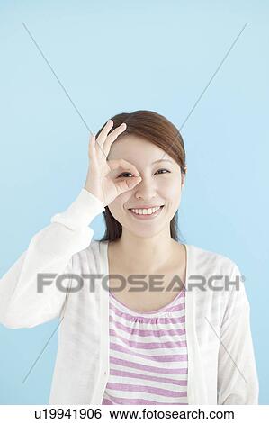 Young Woman Looking Through Fingers View Large Photo Image Stock Photograph - Young Woman Looking Through Fingers. Fotosearch