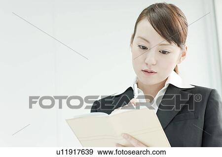 Stock Photo - Young Woman Searching for Jobs. Fotosearch