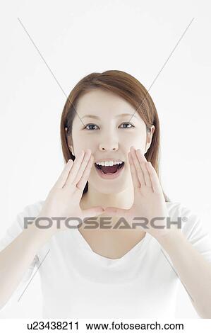 Stock Image - Young Woman Shouting. Fotosearch