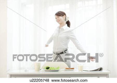 Stock Photo - Young Woman Stretching in Morning. Fotosearch