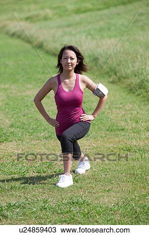 Young woman stretching View Large Photo Image Stock Image - Young woman stretching. Fotosearch