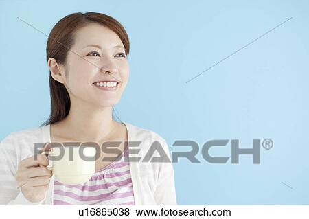 Stock Photo - Young Woman with Cup. Fotosearch