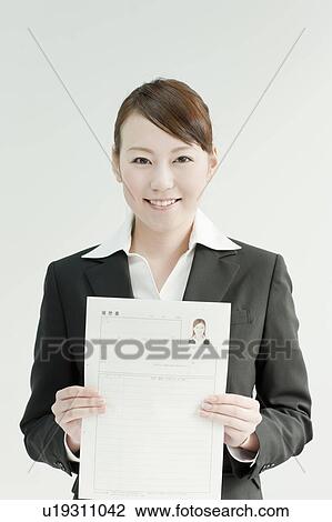 Stock Image - Young Woman with CV. Fotosearch