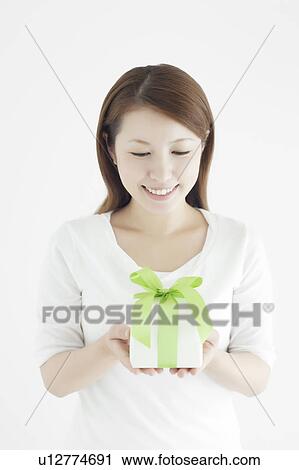 Stock Image - Young Woman with Gift Box. Fotosearch