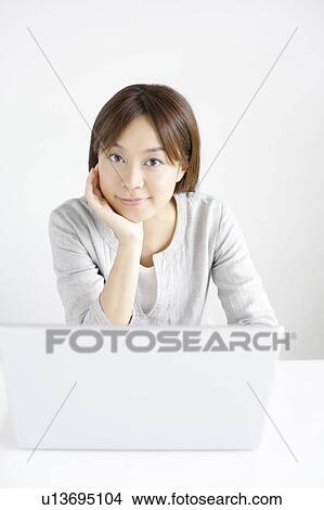Young woman with laptop View Large Photo Image Picture - Young woman with laptop. Fotosearch