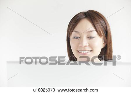 Young woman with laptop View Large Photo Image Stock Image - Young woman with laptop. Fotosearch