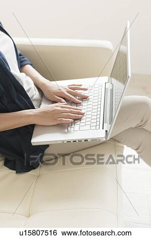 Young woman with laptop View Large Photo Image Stock Photograph - Young woman with laptop. Fotosearch