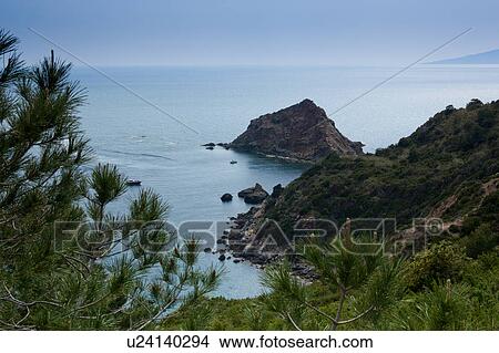 Aerial coastline view, Monte Argentario (Orbetello), Tuscany Italy, view of sea and rocky shoreline on sunny spring afternoon. View Large Photo Image Picture - Aerial coastline view, Monte Argentario (Orbetello), Tuscany Italy, view of sea and rocky shoreline on sunny spring afternoon.. Fotosearch