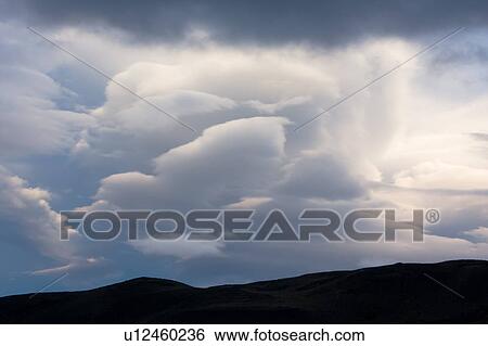 Cloud detail, lenticular cloud. sunset, with hills silhouetted below, Torres del Paine, Southern Chile, Patagonia View Large Photo Image Stock Photograph - Cloud detail, lenticular cloud. sunset, with hills silhouetted below, Torres del Paine, Southern Chile, Patagonia. Fotosearch
