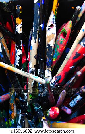Collection of used paint brushes, spattered with multicoloured, vivid paints, in black plastic bucket View Large Photo Image Stock Image - Collection of used paint brushes, spattered with multicoloured, vivid paints, in black plastic bucket. Fotosearch