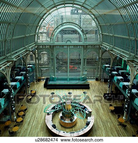 Picture - Covent Garden, Royal Opera House, Paul Hamlyn Hall, desaturated image of wrought iron and glass ceiling, aerial view of hall with cafe tables, road ouside, with red van (coloured). Fotosearch