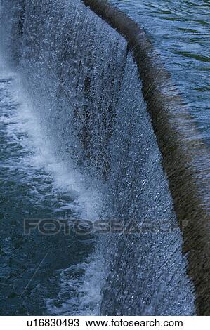 Stock Image - Detail of waterfall, hydroelectic dam. Fotosearch