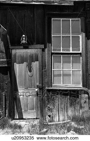 Detail of wooden house with doorway, window overlooking garden and wooden picket fence, desaturated image, Bodie pioneer village, California View Large Photo Image Stock Photography - Detail of wooden house with doorway, window overlooking garden and wooden picket fence, desaturated image, Bodie pioneer village, California. Fotosearch