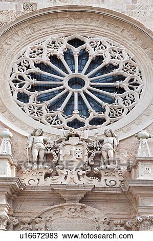 Detail view of medieval rose window and staute decoration below, facade of Duomo, Otranto, Salento, Puglia, Southern Italy View Large Photo Image Stock Image - Detail view of medieval rose window and staute decoration below, facade of Duomo, Otranto, Salento, Puglia, Southern Italy. Fotosearch
