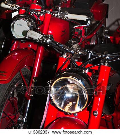 Detail view of Moto Guzzi antique red motorbikes front view, Italy View Large Photo Image Stock Photo - Detail view of Moto Guzzi antique red motorbikes front view, Italy. Fotosearch