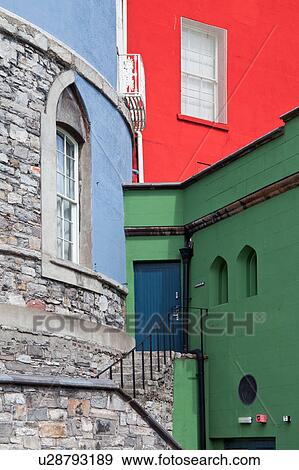 Stock Photo - Detail view of south facade of Dublin Castle, with different areas painted green, blue, red, against grey Norman stone of original fortifications, Dublin, Southern Ireland. Fotosearch