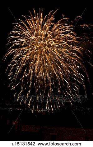 Fireworks exploding, with town lights of Umbrian valley in distance, Italy View Large Photo Image Stock Image - Fireworks exploding, with town lights of Umbrian valley in distance, Italy. Fotosearch