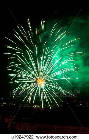 Fireworks exploding, with town lights of Umbrian valley in distance, Italy View Large Photo Image Stock Image - Fireworks exploding, with town lights of Umbrian valley in distance, Italy. Fotosearch