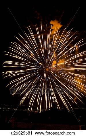 Fireworks exploding, with town lights of Umbrian valley in distance, Italy View Large Photo Image Stock Image - Fireworks exploding, with town lights of Umbrian valley in distance, Italy. Fotosearch