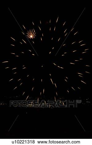 Fireworks exploding, with town lights of Umbrian valley in distance, Italy View Large Photo Image Stock Photo - Fireworks exploding, with town lights of Umbrian valley in distance, Italy. Fotosearch