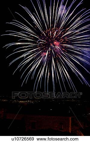 Fireworks exploding, with town lights of Umbrian valley in distance, Italy View Large Photo Image Stock Photo - Fireworks exploding, with town lights of Umbrian valley in distance, Italy. Fotosearch