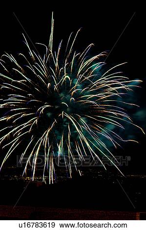 Fireworks exploding, with town lights of Umbrian valley in distance, Italy View Large Photo Image Stock Photo - Fireworks exploding, with town lights of Umbrian valley in distance, Italy. Fotosearch