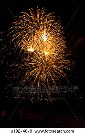 Fireworks exploding, with town lights of Umbrian valley in distance, Italy View Large Photo Image Stock Photo - Fireworks exploding, with town lights of Umbrian valley in distance, Italy. Fotosearch