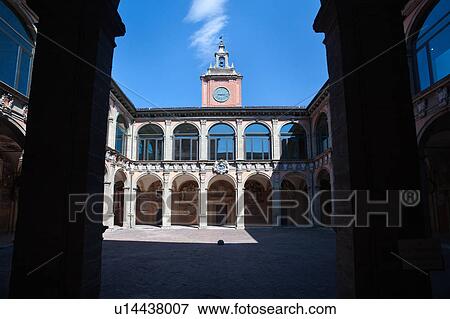 Loggia at entrance of Palazzo Archiginnasio, with view from under arch, of the two-tiered Renaissance buildings and central tower surrounding the courtyard, Bologna, Italy View Large Photo Image Stock Photo - Loggia at entrance of Palazzo Archiginnasio, with view from under arch, of the two-tiered Renaissance buildings and central tower surrounding the courtyard, Bologna, Italy. Fotosearch