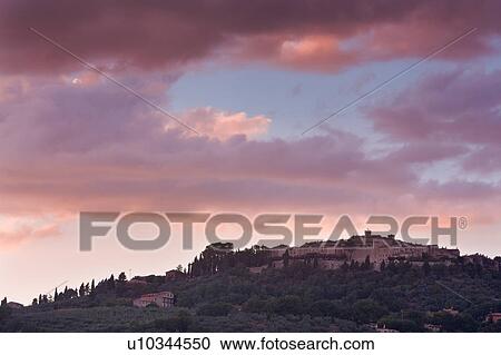 Medieval hilltop town of Monte Castello di Vibio, at sunset, with spectacular pink clouds, skyscape, Umbria, Italy View Large Photo Image Stock Image - Medieval hilltop town of Monte Castello di Vibio, at sunset, with spectacular pink clouds, skyscape, Umbria, Italy. Fotosearch