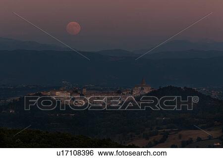 Moonrise over Todi, Umbria, with view of medieval hilltop town in foreground, and full moon over mountains in background. View Large Photo Image Stock Photograph - Moonrise over Todi, Umbria, with view of medieval hilltop town in foreground, and full moon over mountains in background.. Fotosearch