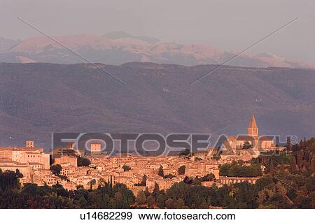 Panorama view of medieval hilltop town of Todi, at sunset, with spire of San Fortunato, Umbria, Italy View Large Photo Image Stock Photo - Panorama view of medieval hilltop town of Todi, at sunset, with spire of San Fortunato, Umbria, Italy. Fotosearch