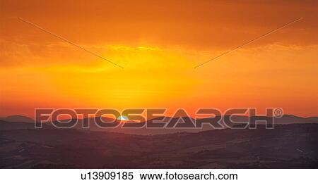 Panoramic view of sunrise over Umbrian hills, orange-yellow sky against rolling purple mountains View Large Photo Image Stock Photography - Panoramic view of sunrise over Umbrian hills, orange-yellow sky against rolling purple mountains. Fotosearch