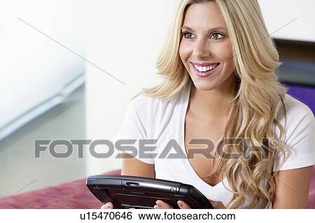 Beautiful woman using Tablet PC View Large Photo Image Stock Photograph - Beautiful woman using Tablet PC. Fotosearch