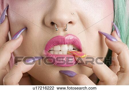 Close-up of a woman's mouth and fingers View Large Photo Image Stock Image - Close-up of a woman's mouth and fingers. Fotosearch