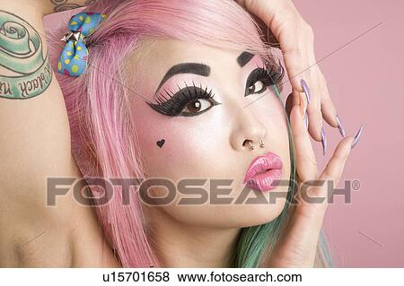 Stock Photo - Close-up of a young woman posing. Fotosearch