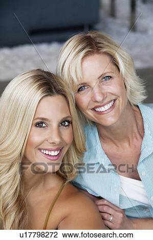 Close-up of portrait of beautiful young woman with her mother View Large Photo Image Stock Image - Close-up of portrait of beautiful young woman with her mother. Fotosearch